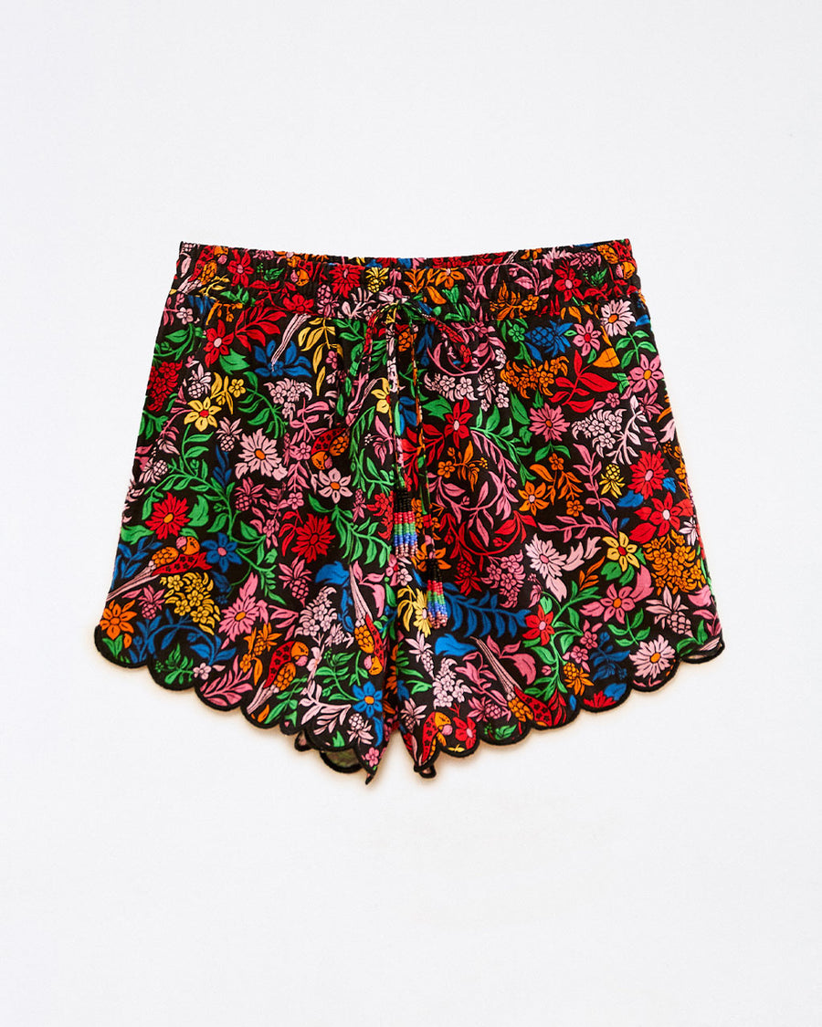 still image of scalloped hem shorts with black ground and all over multi wildflower print