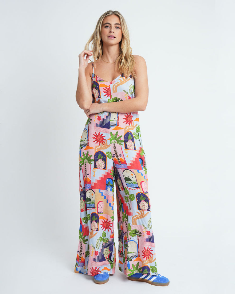 model wearing fun, colorful abstract print jumpsuit