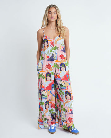 model wearing fun, colorful abstract print jumpsuit with pockets