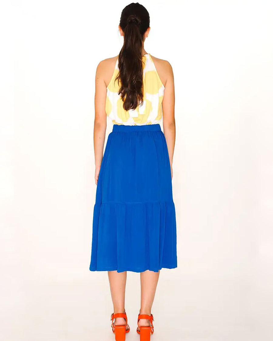 back view of model wearing royal blue button down ruffle midi skirt