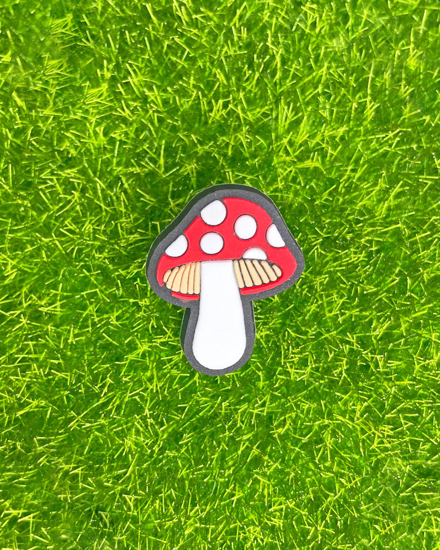 up close of red and white mushroom croc shoe charm