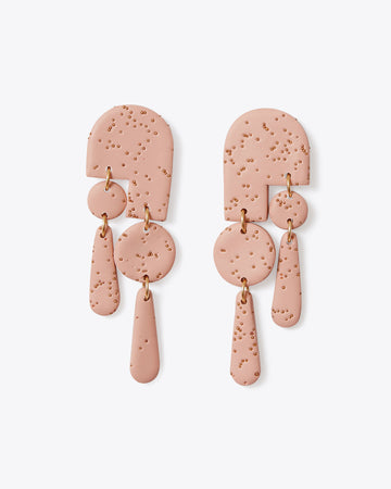 pair of polymer clay earrings with tiny speckle design in blush pink