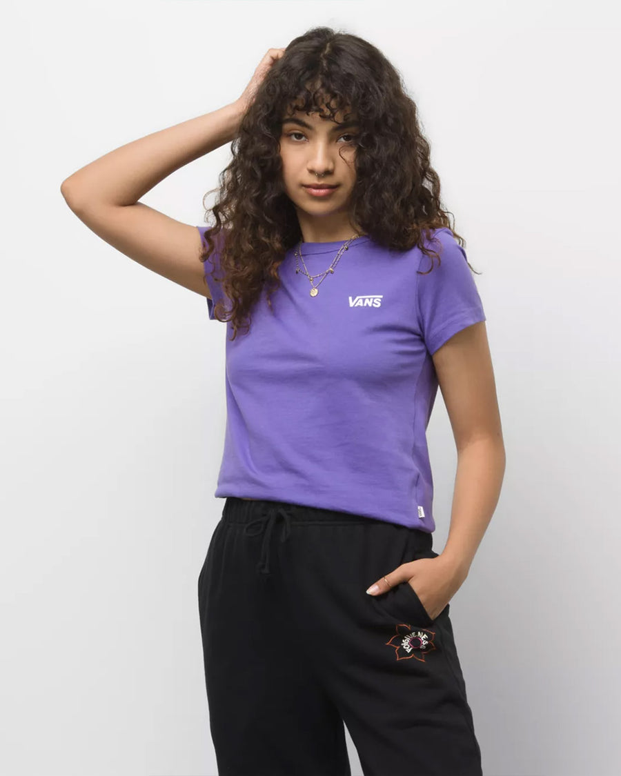 model wearing purple tee with 'vans' graphic on left corner and black sweatpants