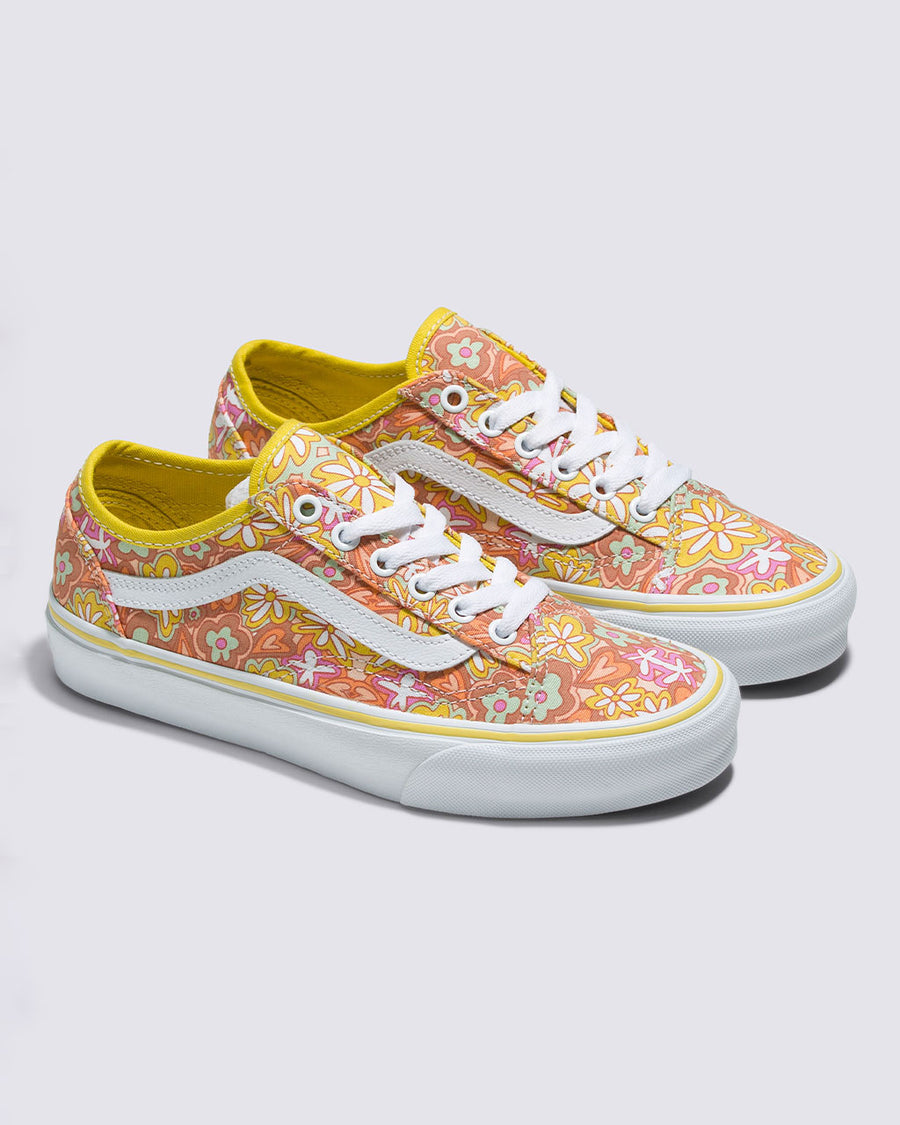 pair of vans old skool tapered shoe with vibrant retro inspired floral and heart print