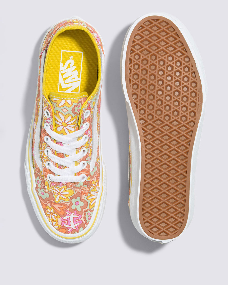 top and bottom view of pair of vans old skool tapered shoe with vibrant retro inspired floral and heart print