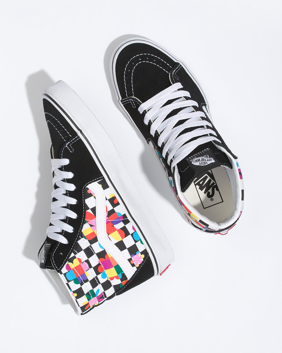 pair of black and white checker vans sk8-hi with multicolor floral print and black suede trim