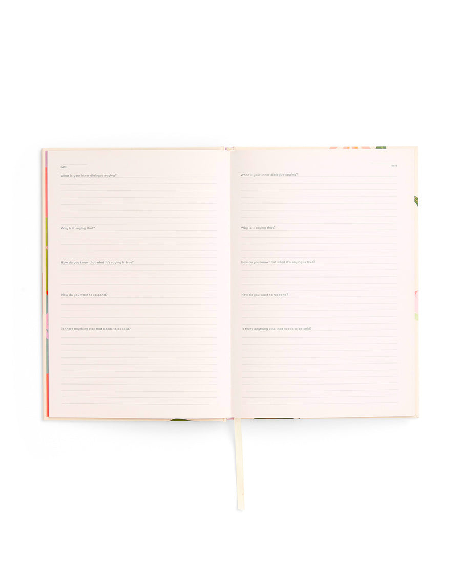 interior view of wellness journal with self care prompts and lined pages