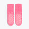 pink cozy socks with tonal "DOING NOTHING" text on sole