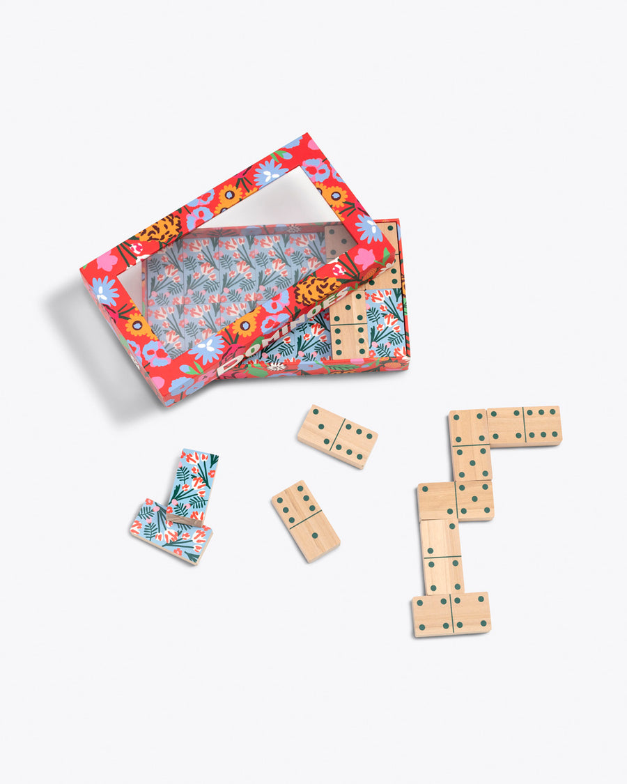 domino set with floral pattern on back and wooden front shown with floral packaging box