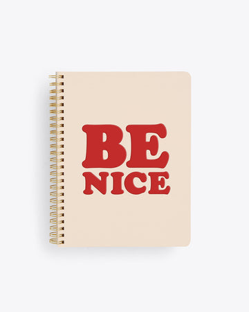 spiral bound notebook cover in ivory with BE NICE text graphic in deep red