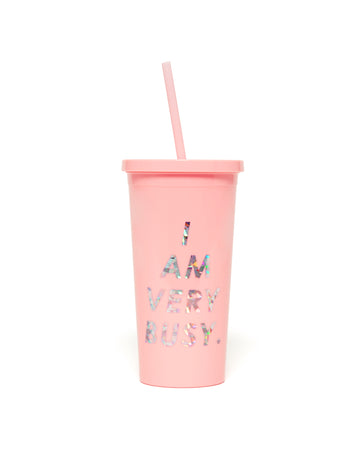 This Sip Sip Tumbler comes in pink, with 'I Am Very Busy' printed in metallic silver on the outside.