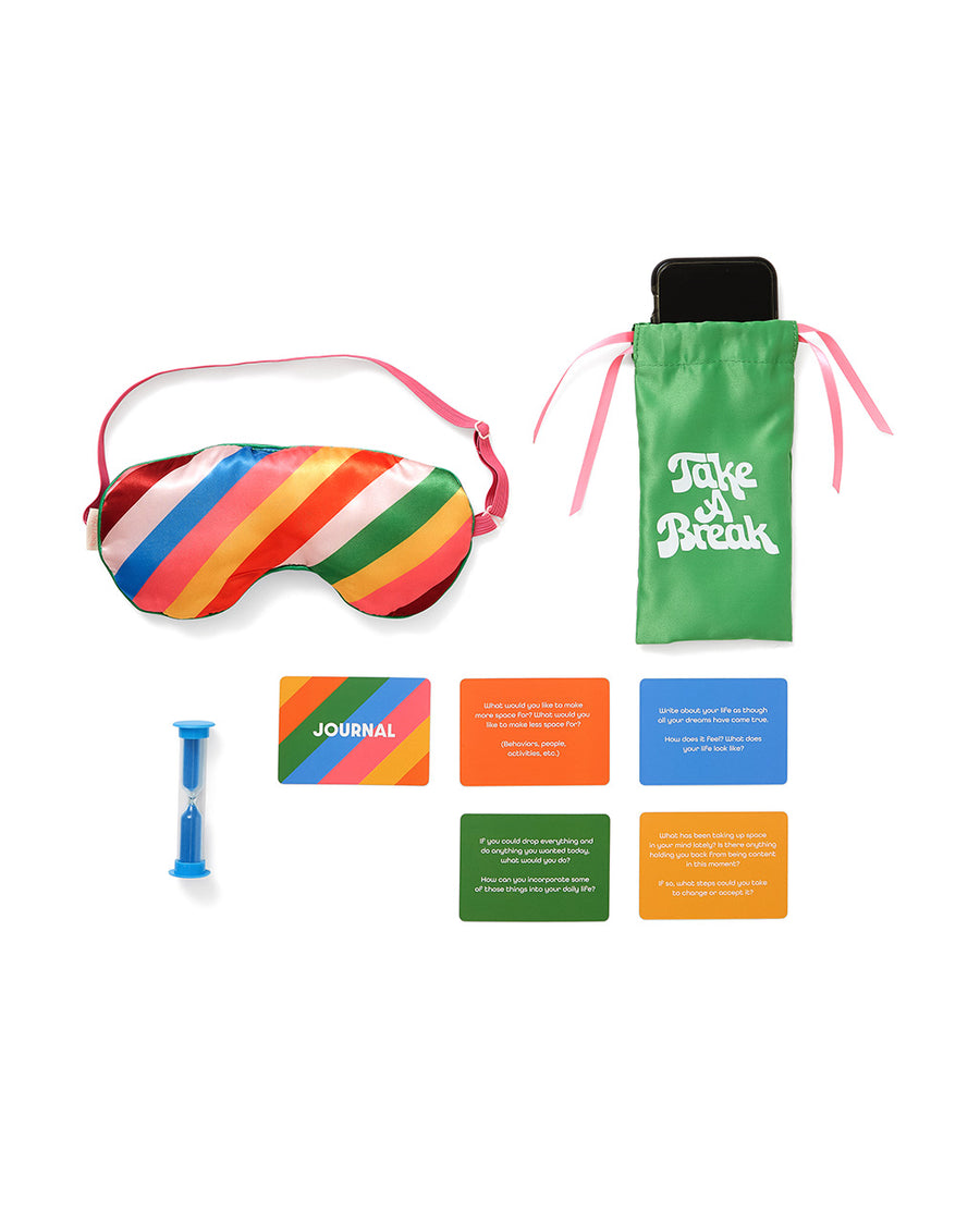 unplug kit with eye mask, phone bag, timer, and journal cards