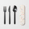 cream color utensil holder and stainless steel utensils